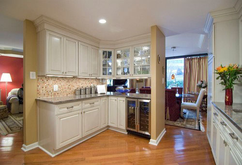 Open kitchen with white cabinetry