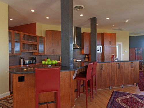 Kitchen with red bar stools