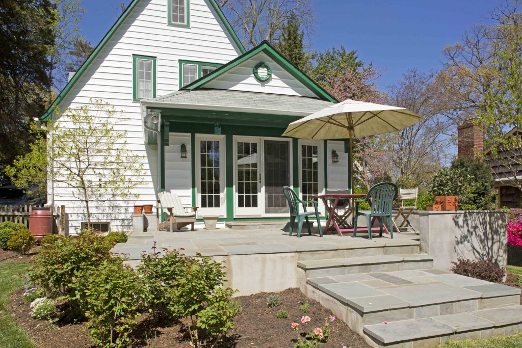 eclectic virginia craftsman home white with green trim slate patio addition