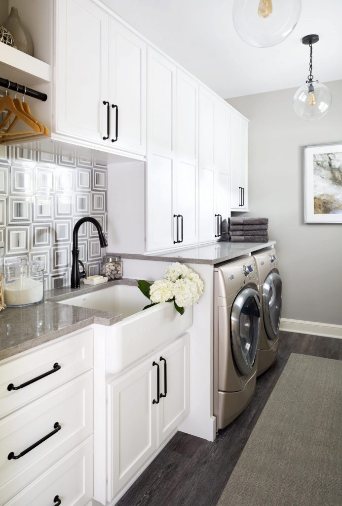 Gray laundry room with patterned wall paper