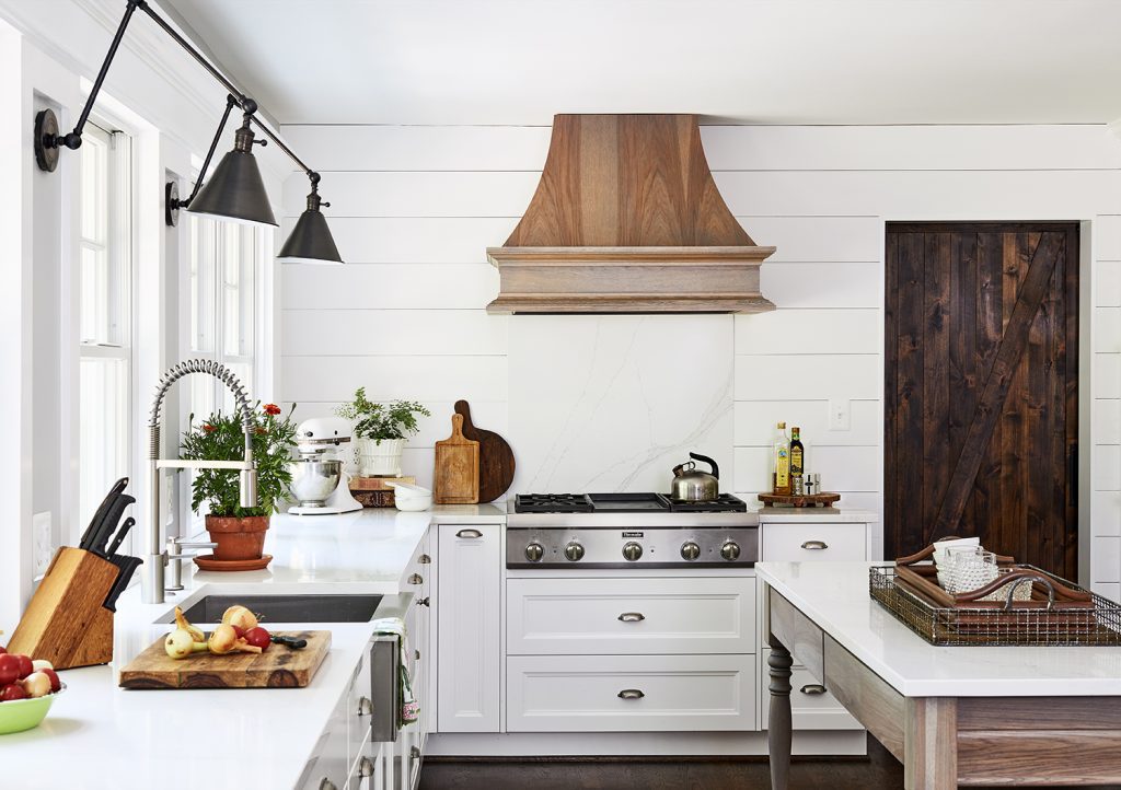 modern light shade of white cabinets with black sconces two lamps wall light fixtures with oak paneling custom range hood