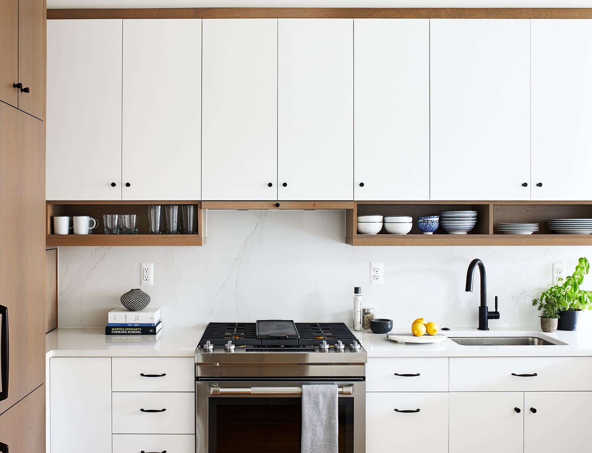 dc remodeling with white cabinets with black knobs and hanging shelves