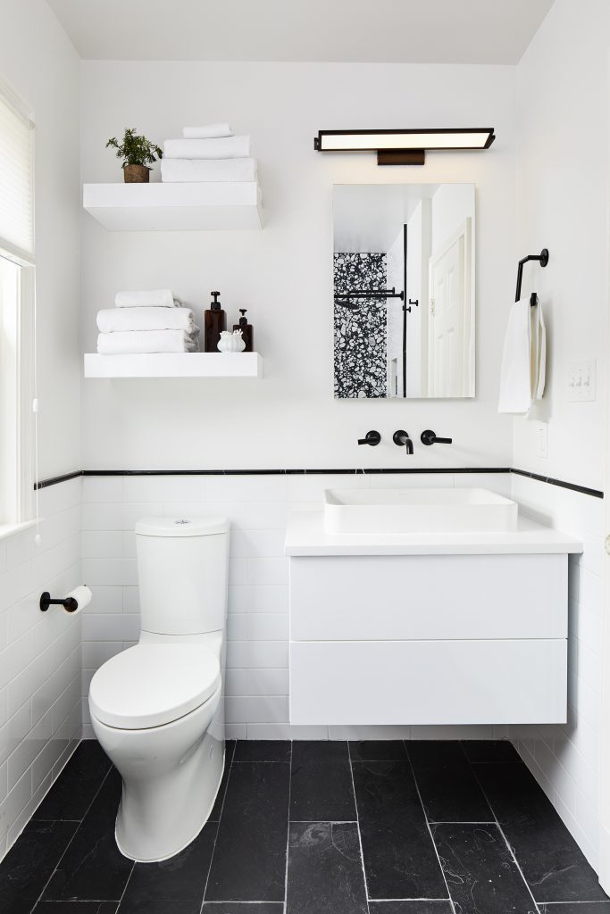 custom modern white bathroom with black slate and terrazo tile